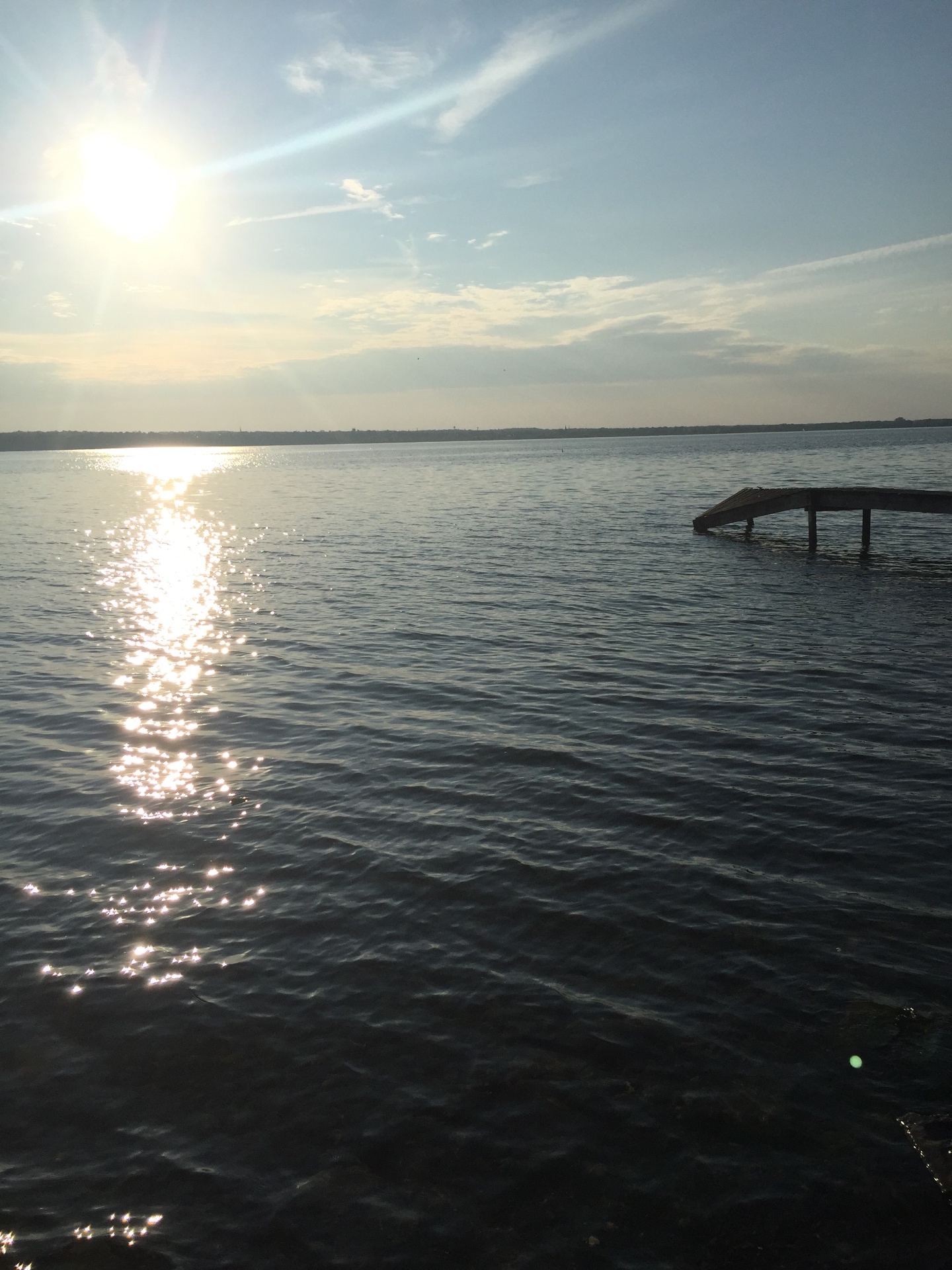 Sun shimmering on a Finger Lakes shoreline